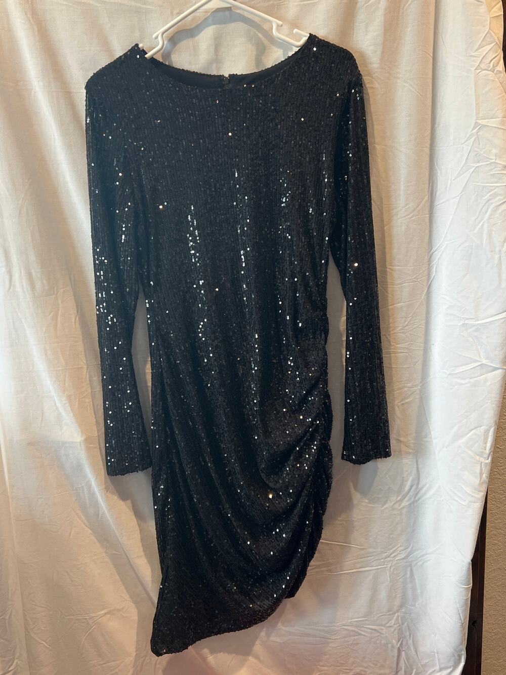 Women’s size 12 long sleeve, cinched, black sequin dress